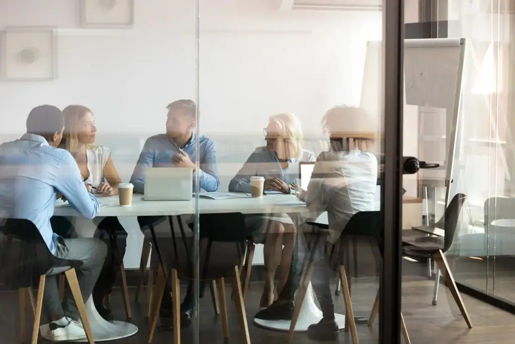 A group of people in a conference room.