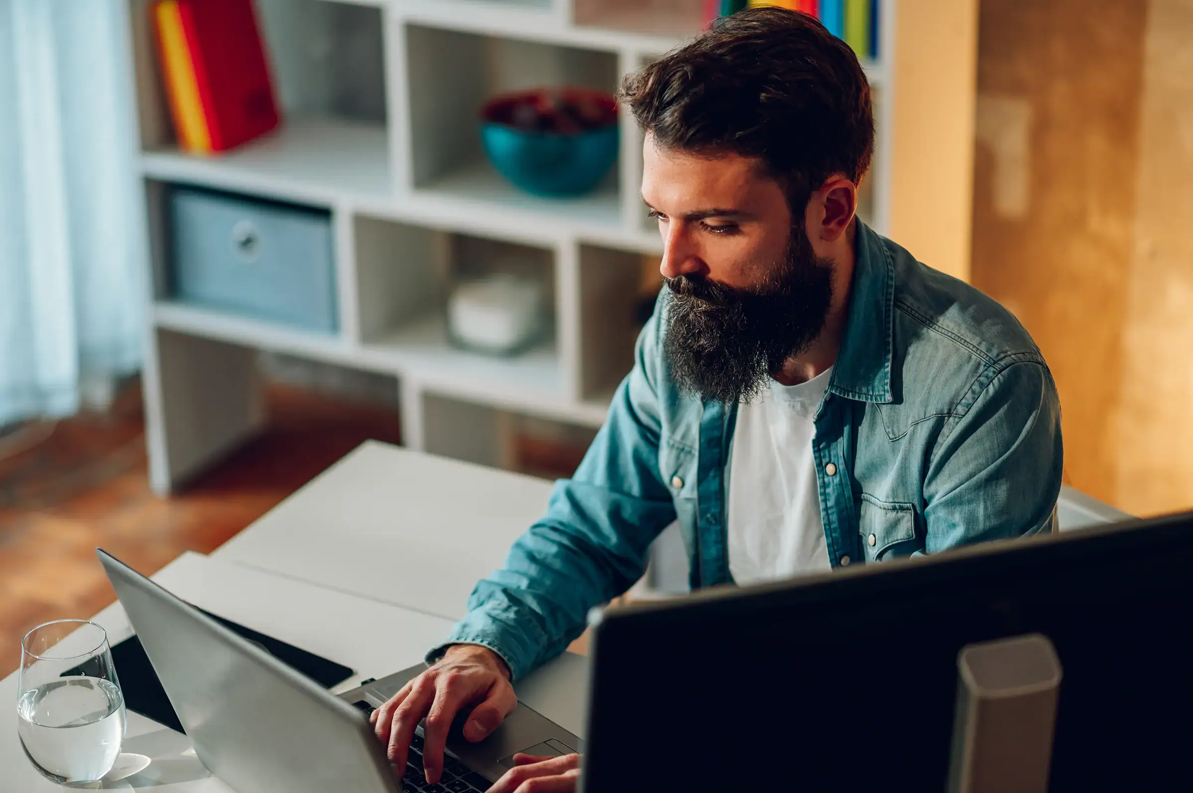 A man using a laptop.