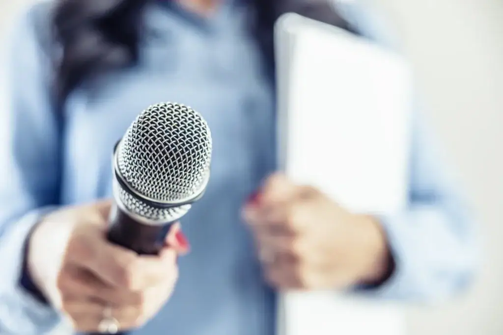 A person holding a microphone.